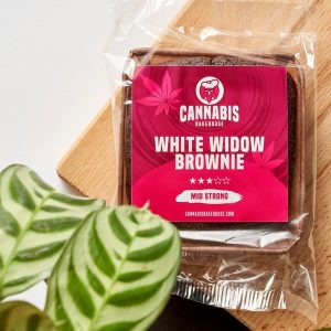 White widow brownie in packaging with plant